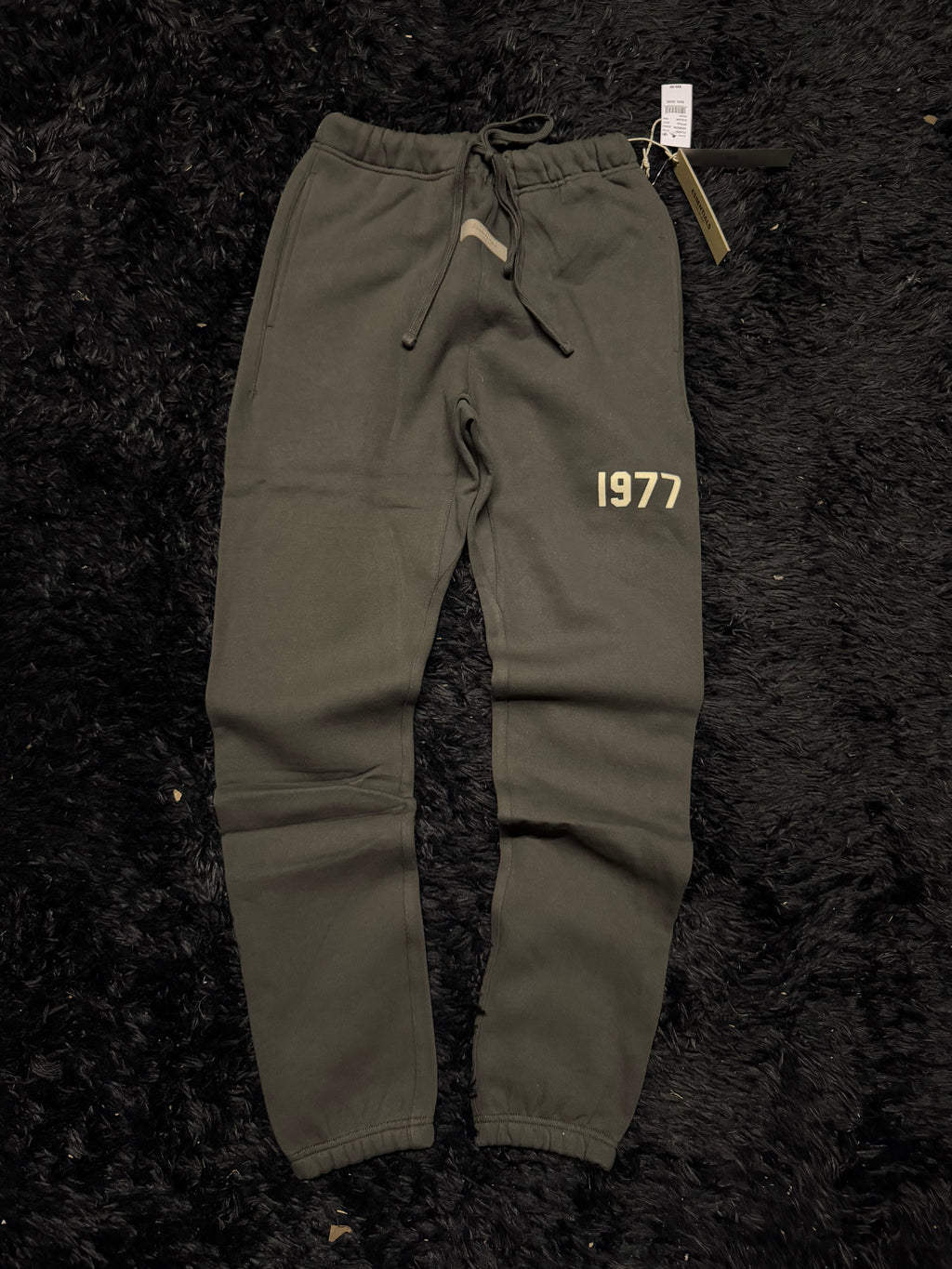 Fear of God Essentials Sweatpants – Black “1977” Logo Joggers