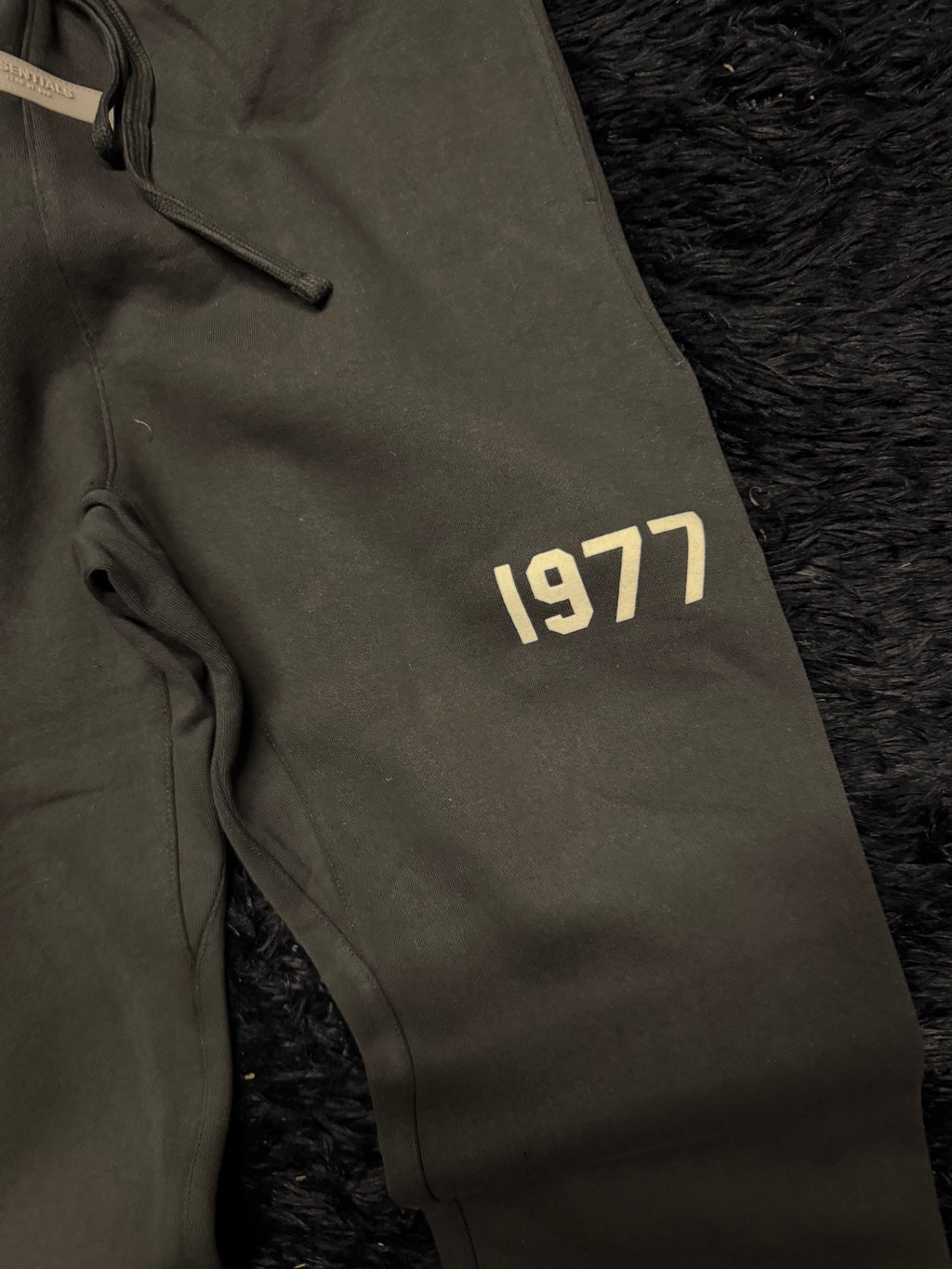 Fear of God Essentials Sweatpants – Black “1977” Logo Joggers