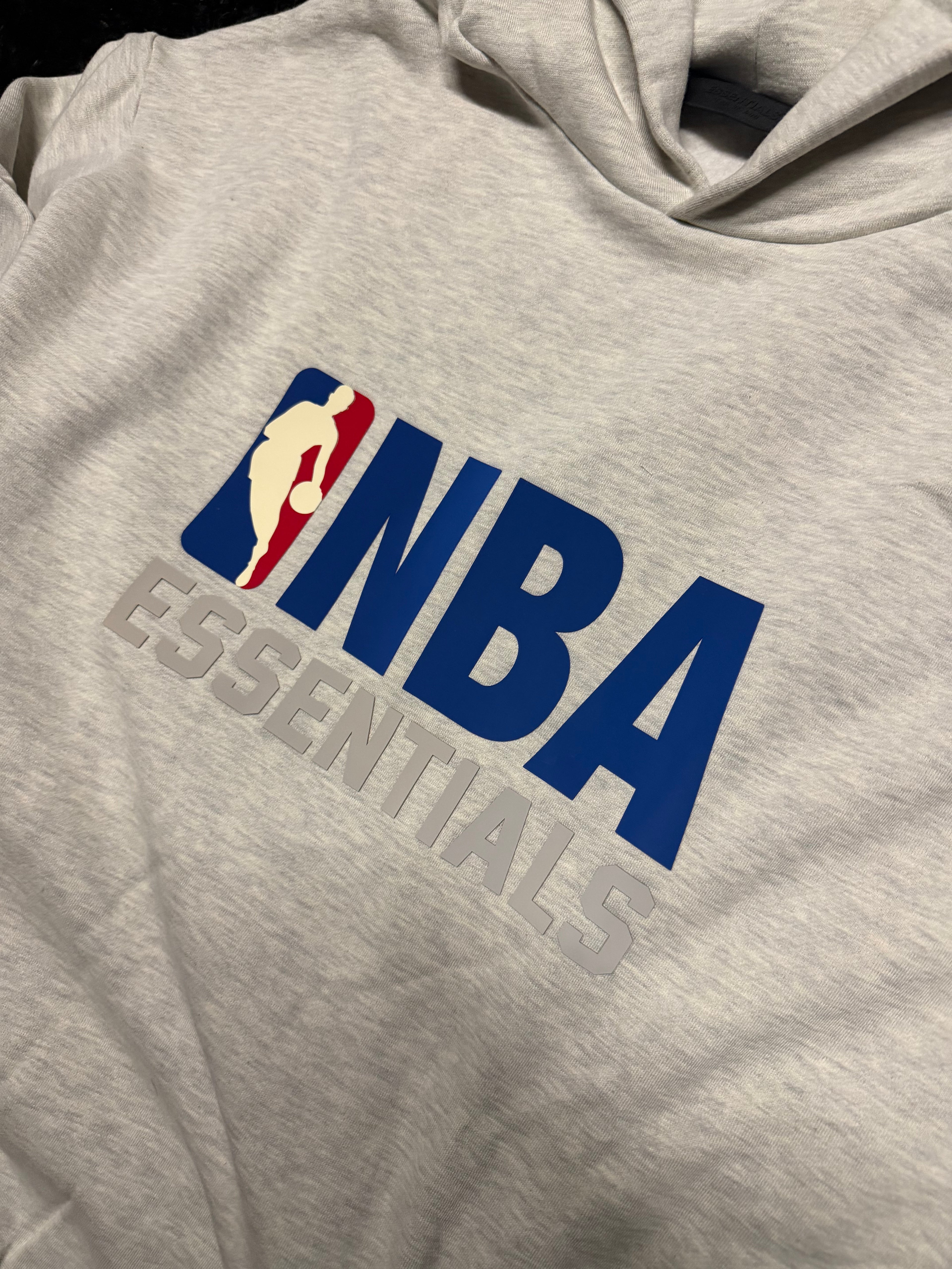 Fear of God Essentials NBA Hoodie – Grey “NBA Essentials” Logo