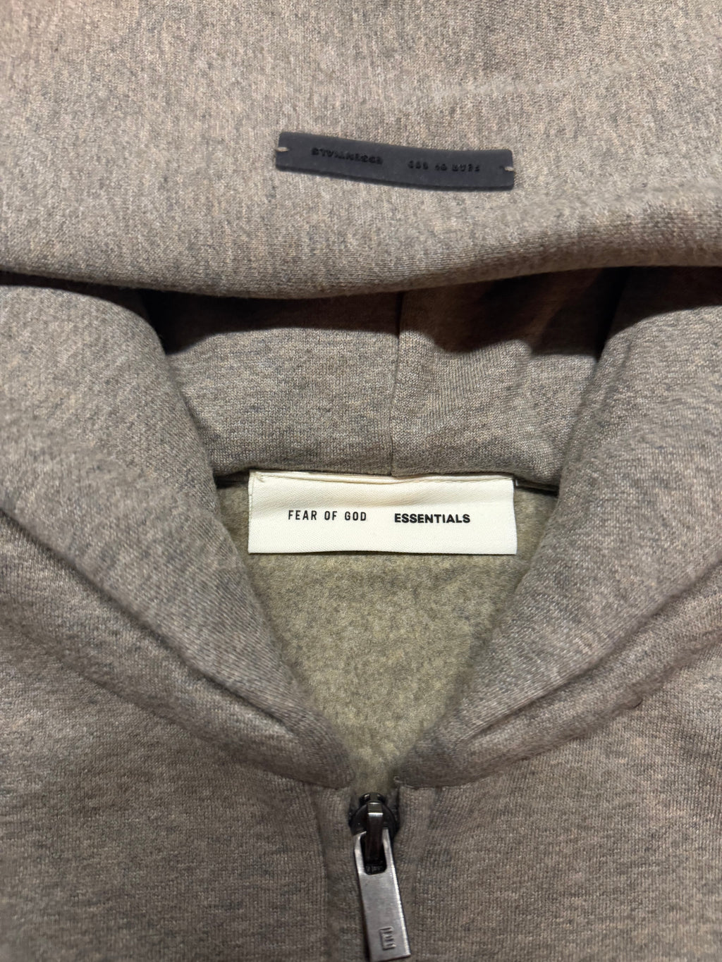 Fear of God Essentials Zip-Up Hoodie – Grey “ESSENTIALS Fear of God” Metallic Logo